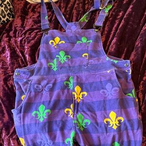 Vibrant Purple Jumpsuit with Fleur-de-Lis Pattern
